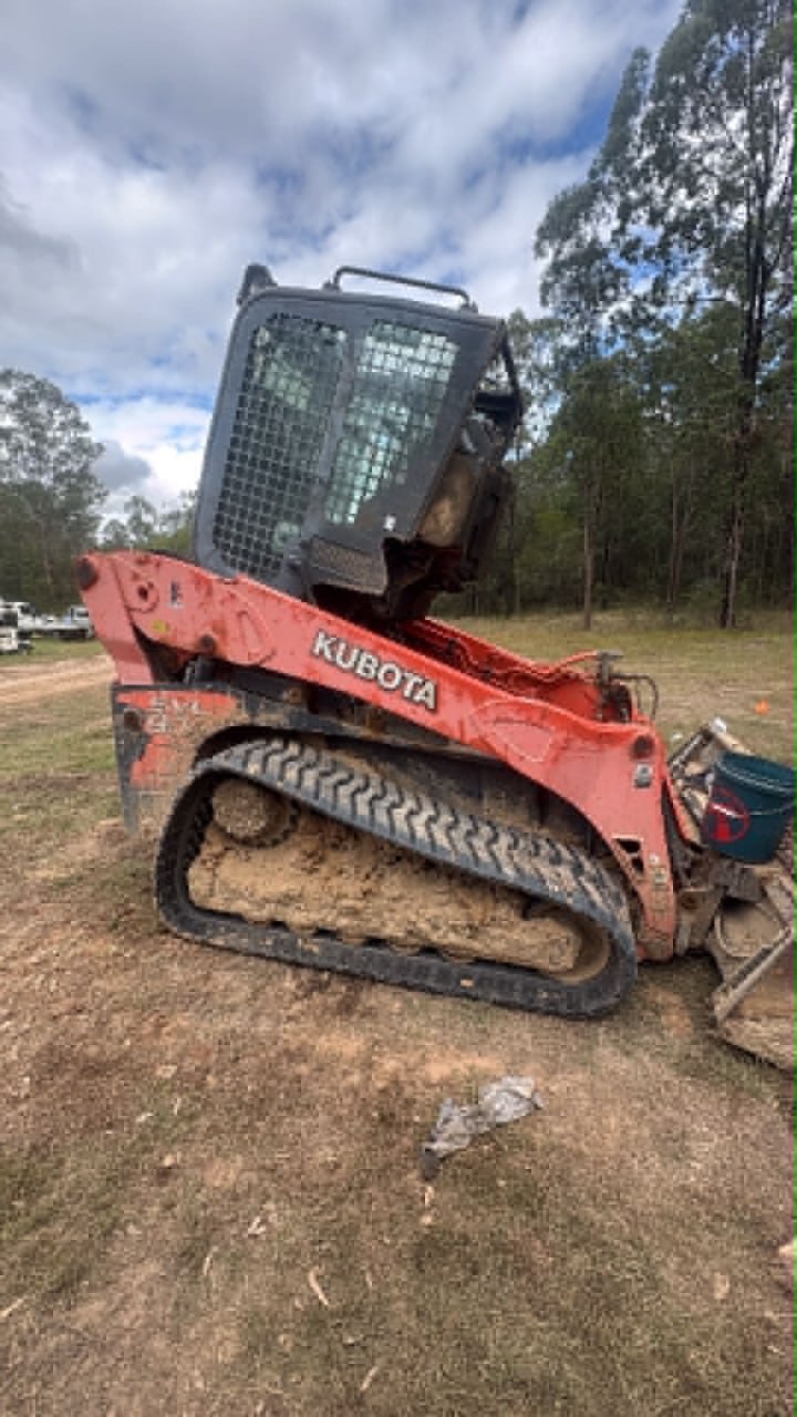 Kubota compact loader with raised cab during service